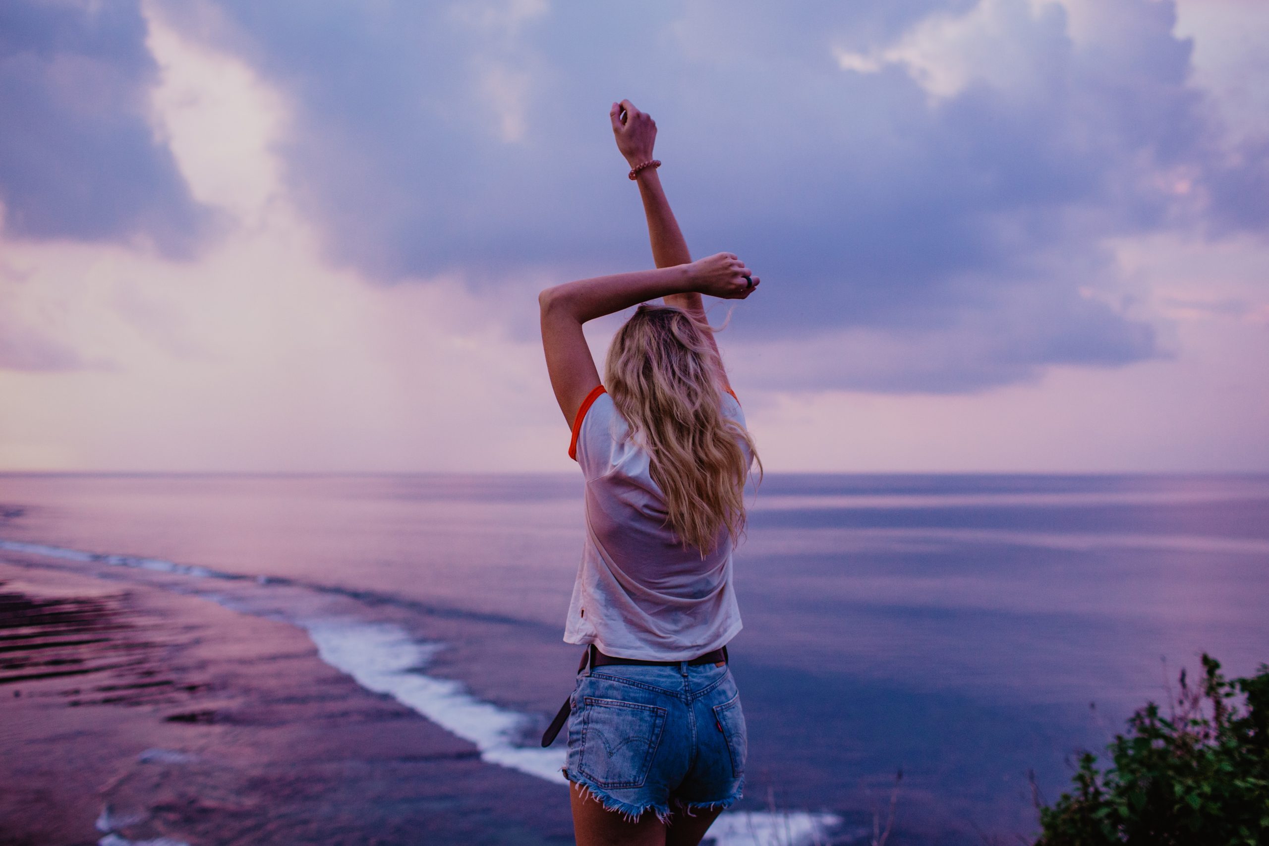 live on your own terms -happy woman at the beach