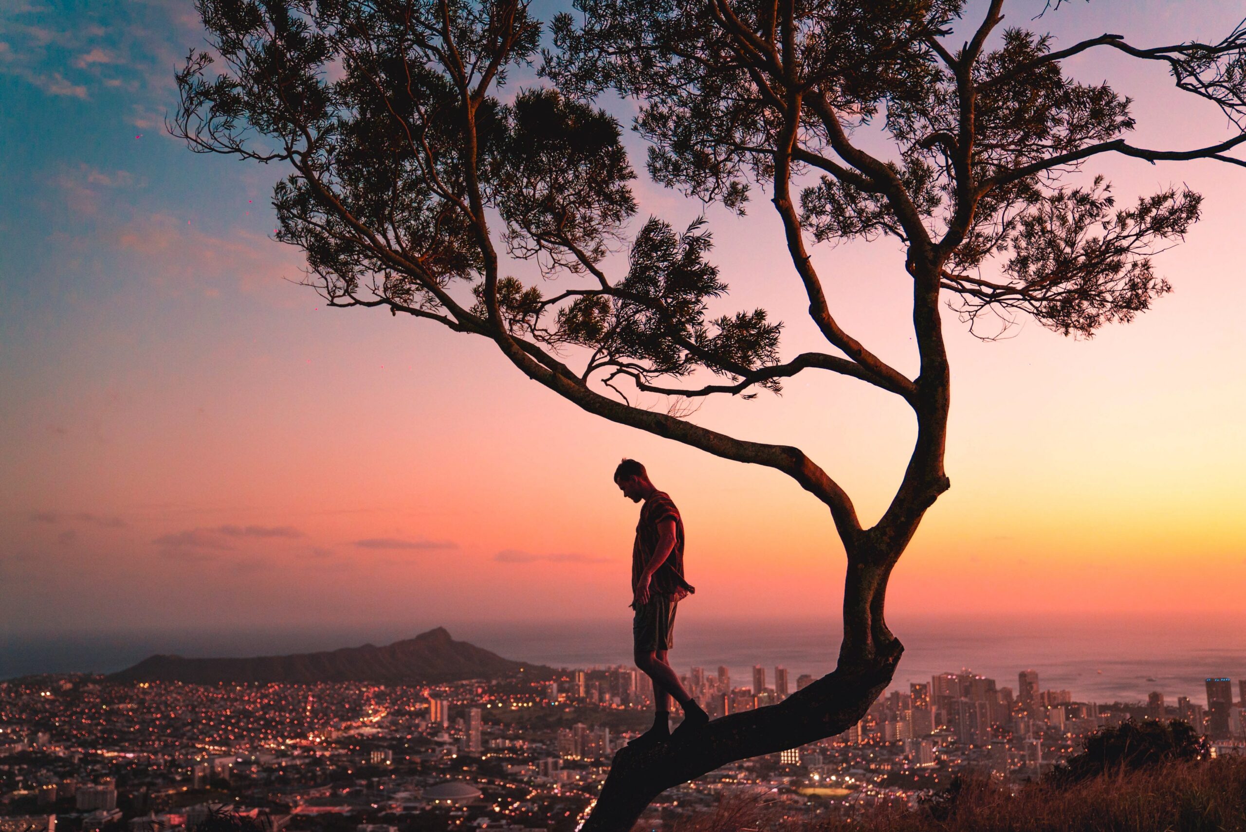 Caring too much, man standing on a tree worrying