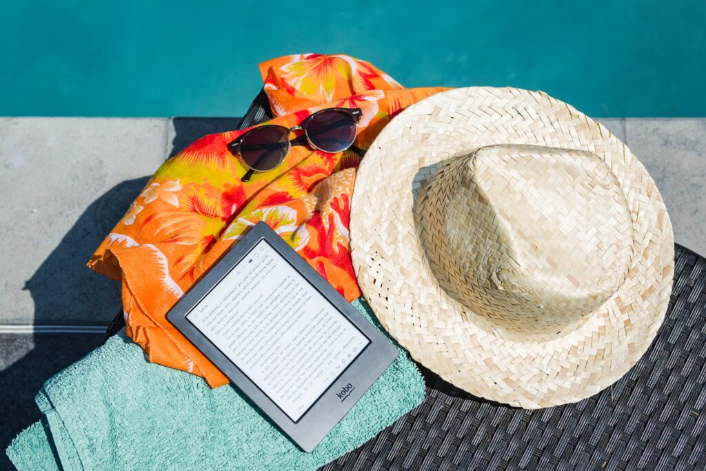 reducing stress strategies - image of a hat by relaxing pool